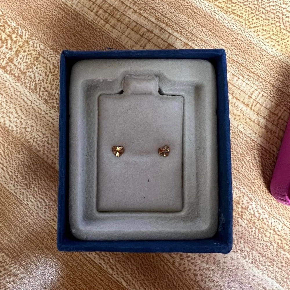 Gold, heart earrings.